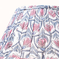 White pleated lampshade with a pink water lily print