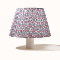 White pleated lampshade with a pink water lily print