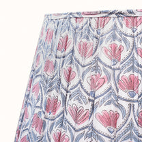 White pleated lampshade with a pink water lily print