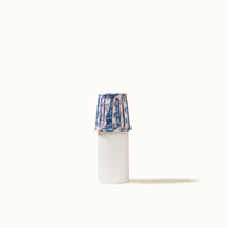 Blue and white pleated lampshade with a turquoise blue floral print