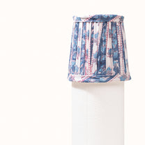 Blue and white pleated lampshade with a turquoise blue floral print