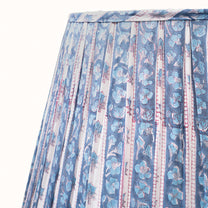 Blue and white pleated lampshade with a turquoise blue floral print