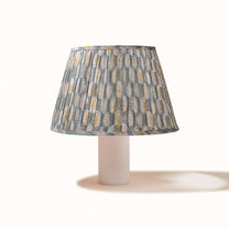 Green-gray pleated lampshade with saffron-yellow print