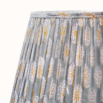 Green-gray pleated lampshade with saffron-yellow print