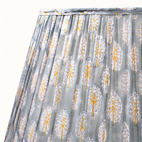Green-gray pleated lampshade with saffron-yellow print
